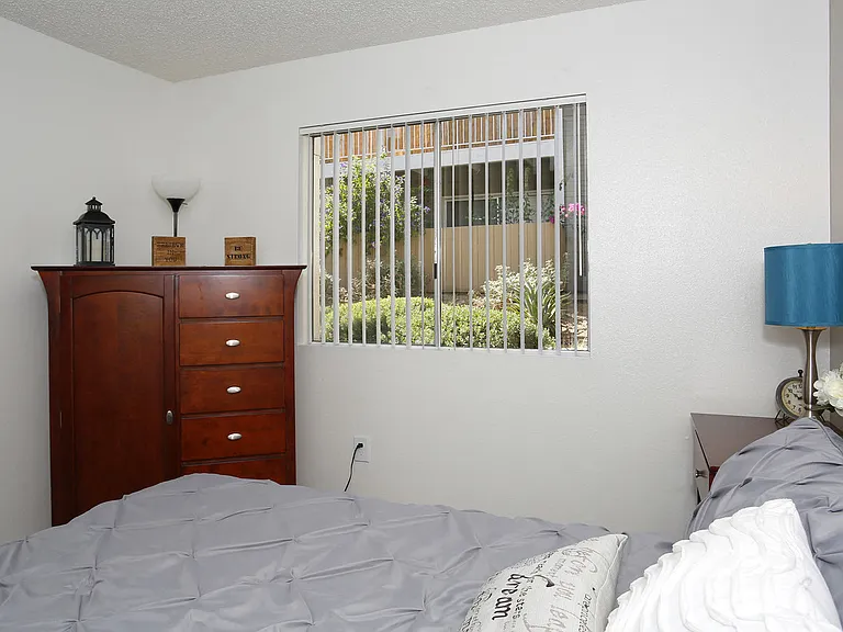 Model Master Bedroom with window and dresser