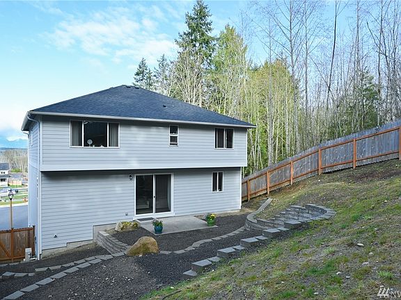 Back side of home and part of the large and private fully fenced backyard.