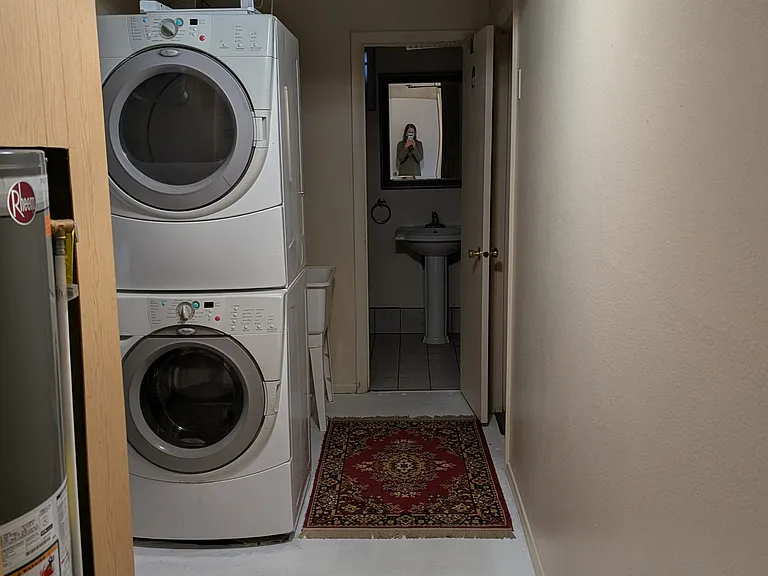 Downstairs laundry room and entrance to 2nd bathroom.