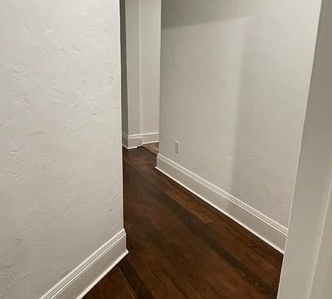 Hallway to Living Room and Den and Kitchen