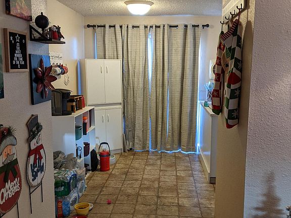 Dining area facing back porch and kitchen.