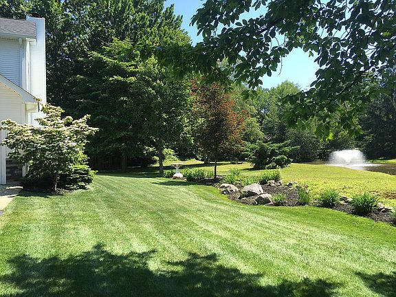 Side yard facing pond
