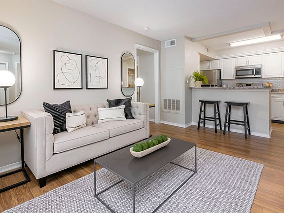 Embrace sprawling living rooms with wood-style flooring.