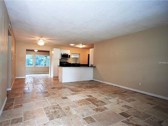 View from entryway to kitchen, eat in area and dining room.
