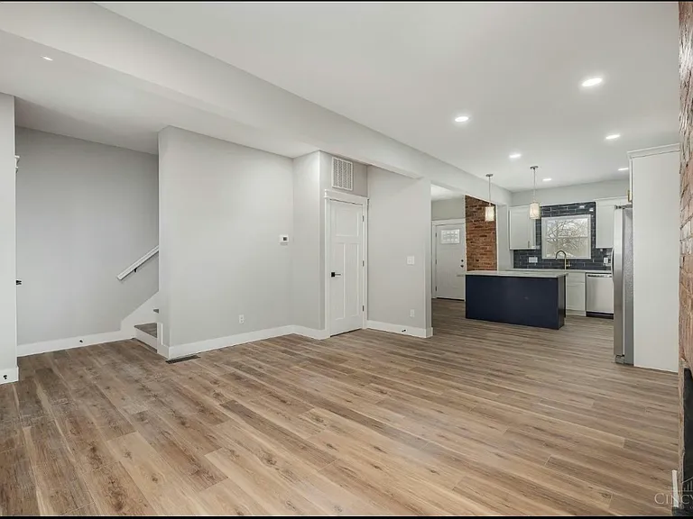(1st floor) Living room and view of kitchen
