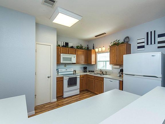 Kitchen - all flooring has been replaced with LPV and walls/cabinets have been painted light gray