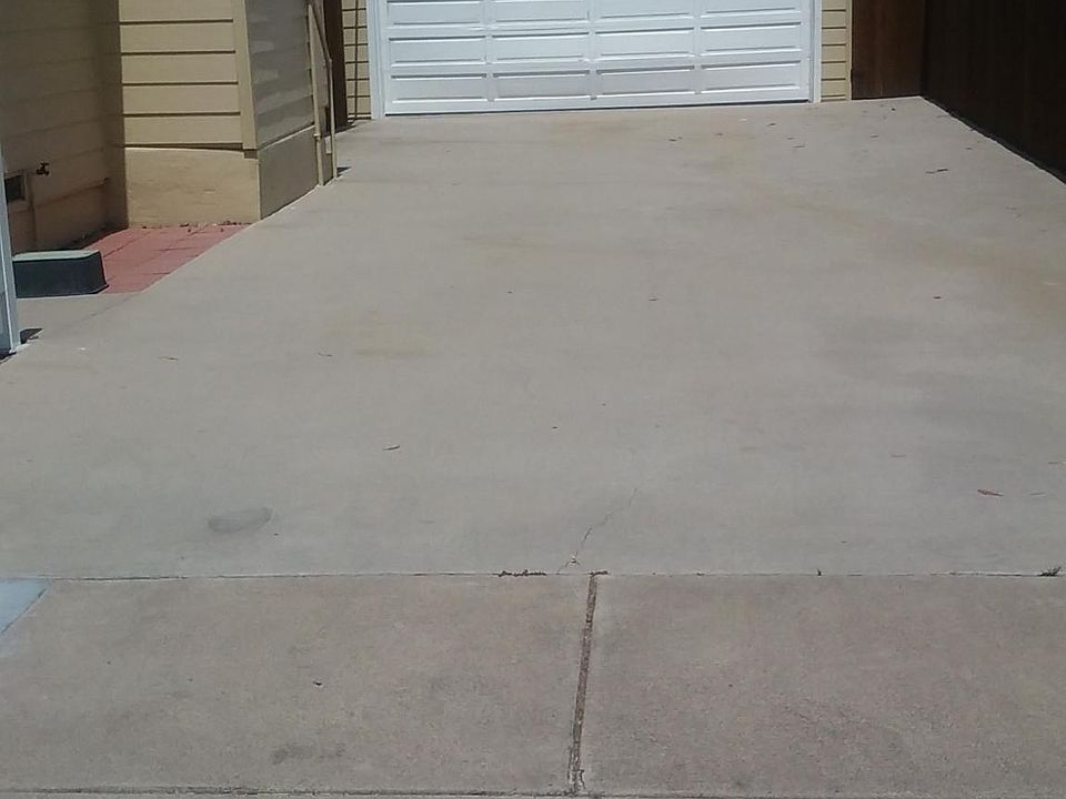 Large Driveway will accommodate 4 cars for off street parking. (Owner maintains garage but has provided a storage unit in the backyard for tenant use)