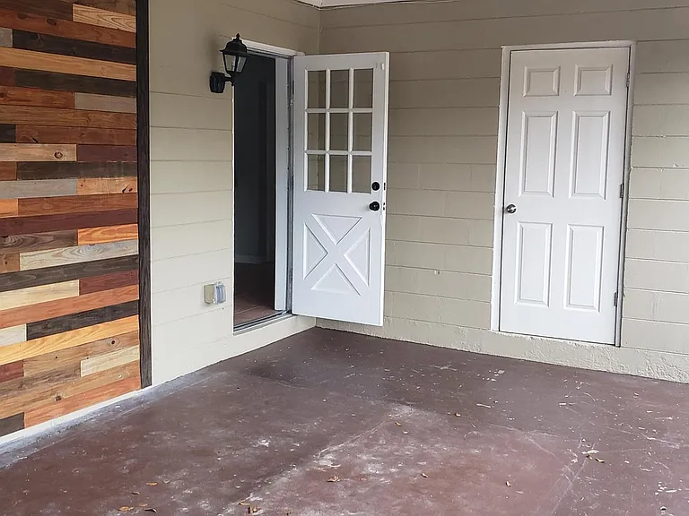 Screened it living area. Previous carport