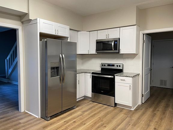 new kitchen cabinets and appliances. Pantry off the kitchen
