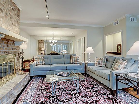 Very spacious living room with dining beyond. Feature Wood burning fireplace and dry bar which could be converted to wet bar - plumbing is there.