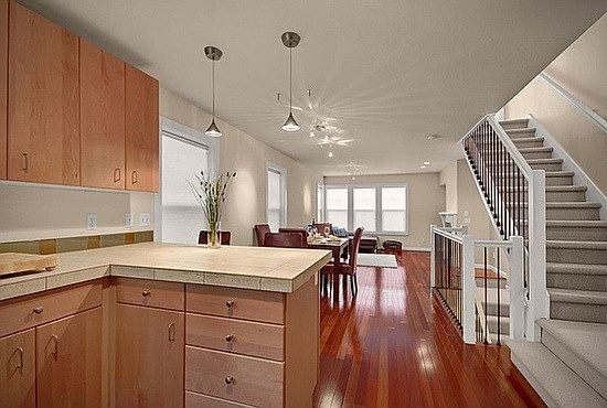 Open plan entertaining level includes modern kitchen, dining