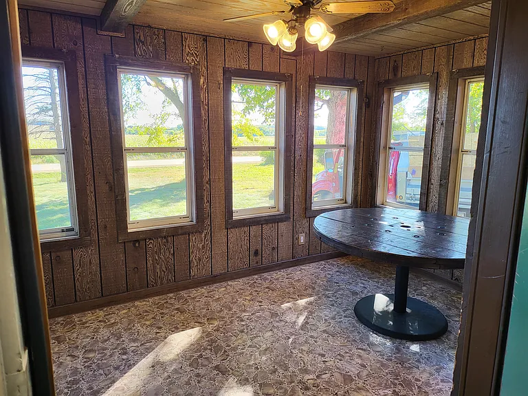 Three season addition going out front door to Deck