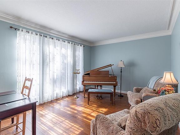 Formal living room at the front of the home can also be used an office.