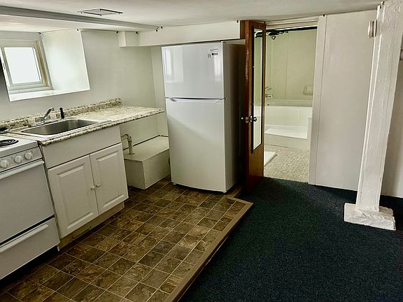 Kitchen adjacent bathroom