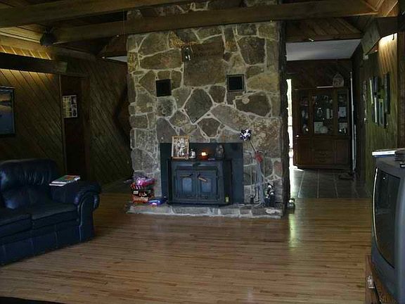 stone, wood-burninf fireplace