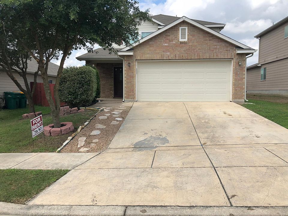 Front view showing a large two car garage.