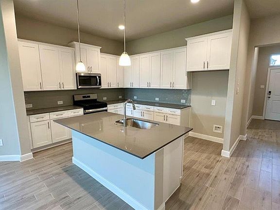 Kitchen - All Home and community information, including pricing, included features, terms, availability and amenities, are subject to change at any time without notice or obligation. All Drawings, pictures, photographs, video, square footages, floor plans, elevations, features, colors and sizes are approximate for illustration purposes only and will vary from the homes as built.