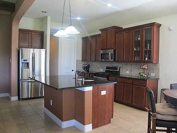 Island kitchen, with stainless steel appliances,
