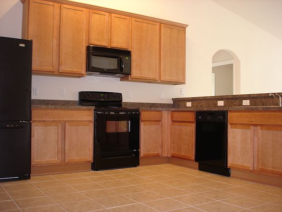 42" uppers, ceramic tile, and all appliances in kitchen.  Volume ceiling too!