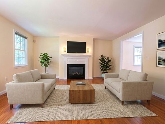 Virtually Staged. he main floor offers a formal living room with decorative fireplace, formal dining room, and cozy family room. The bright eat-in kitchen boasts stainless steel appliances, a BUILT-IN DESK, and sliders to a private deck and yard.