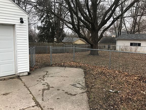 Side parking pad, back yard