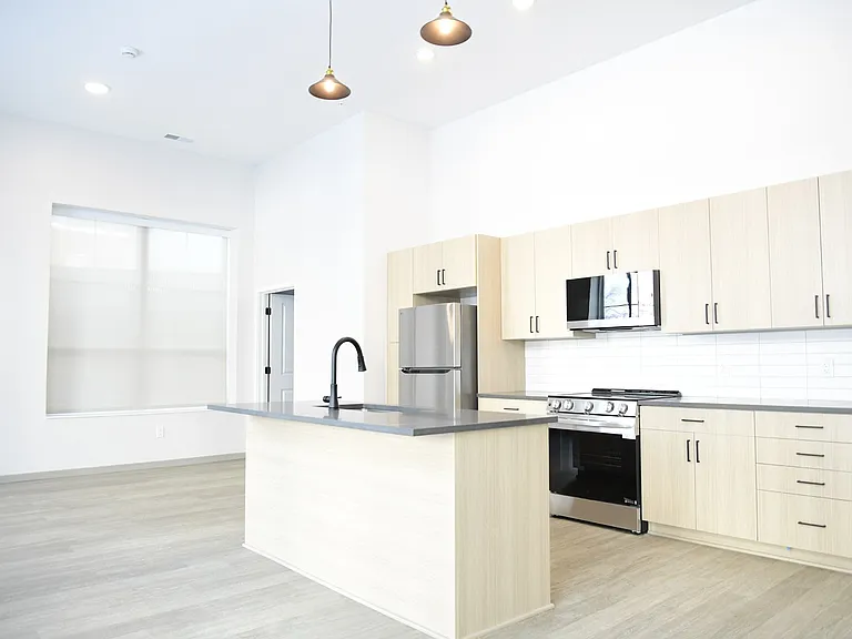 Light granite and warm wood toned kitchen