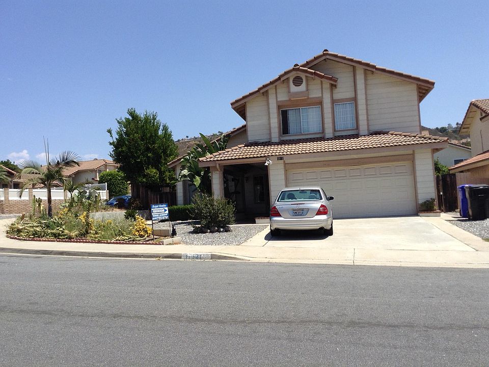 Corner lot, front view, low maintenance front and backyard.