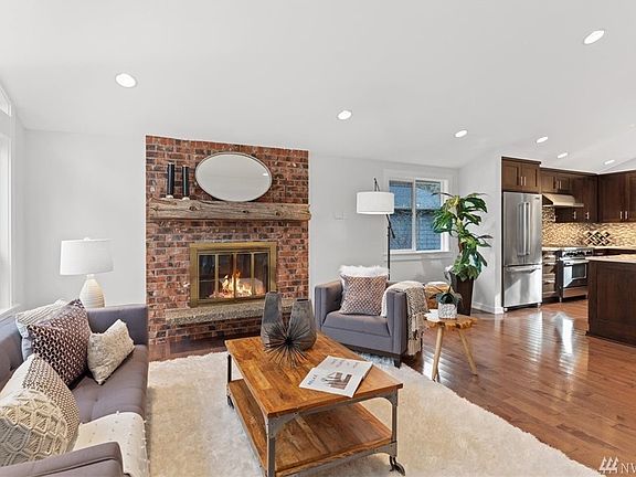 Cozy wood fireplace has also been plumbed with gas for easy addition of a gas insert.  