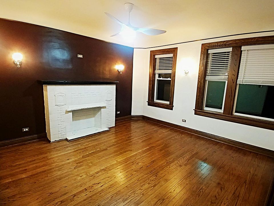 Living room at night. Sconces on walls.