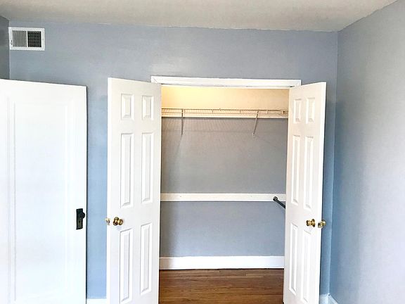Large, French Door Walk-In Closet in Bedroom
