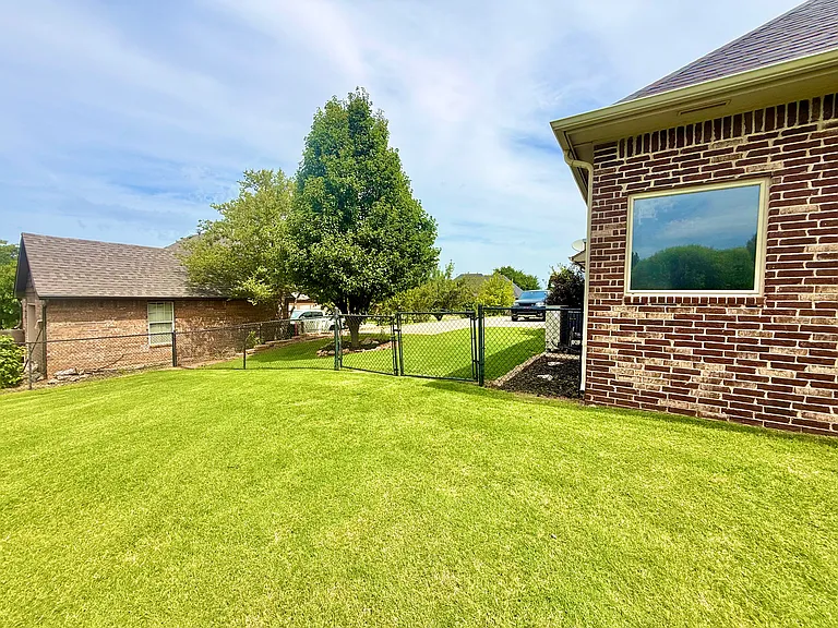 This is the reverse view from the driveway. Notice the double gates. I will be paying for the lawn care. Mowing and weed control.