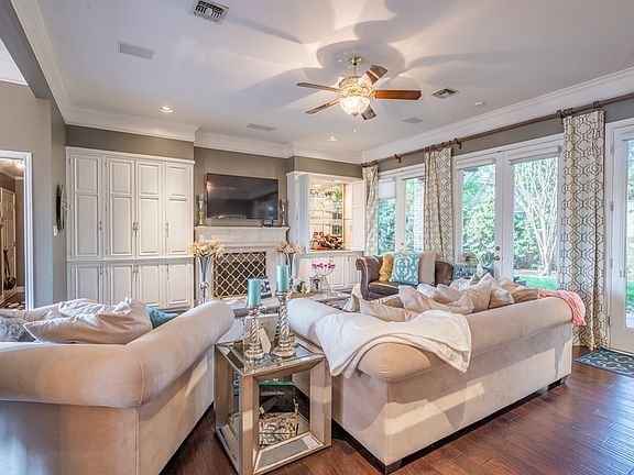 Tons of Windows and Beautiful Wood Floors in Livin