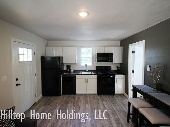 Unit is not rented furnished. Kitchen is equipped with a refrigerator, range, dishwasher, and a microwave.