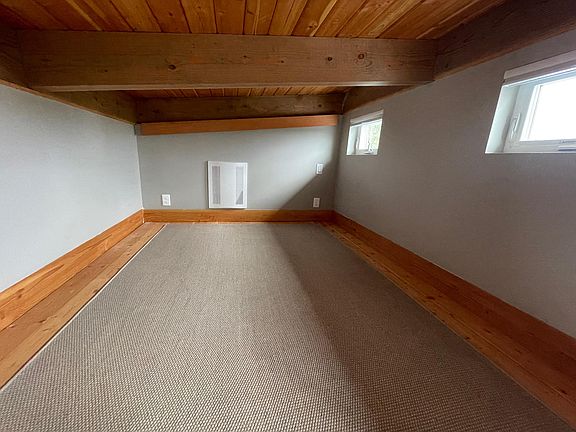 Lofted space. Perfect for meditating, reading. Windows open up to a beautiful views.