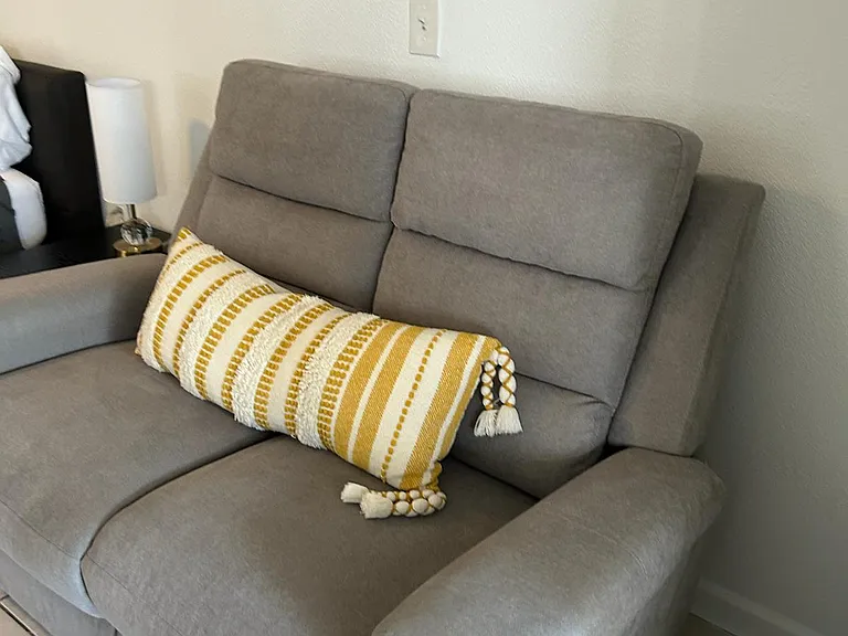 Comfortable accent chair with a stylish cushion for relaxing and unwinding.