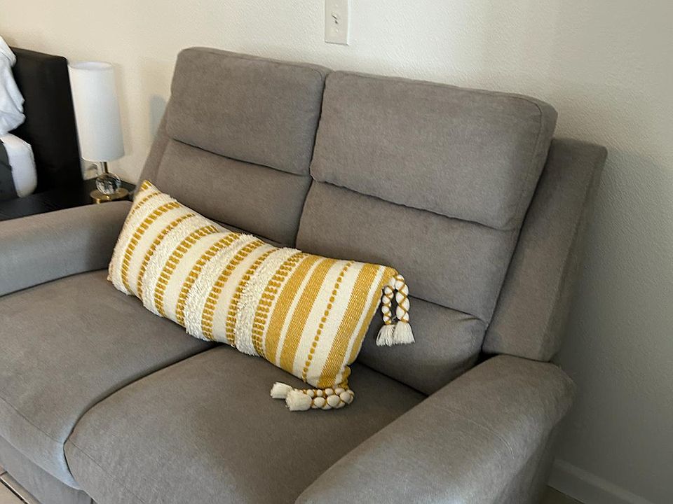 Comfortable accent chair with a stylish cushion for relaxing and unwinding.