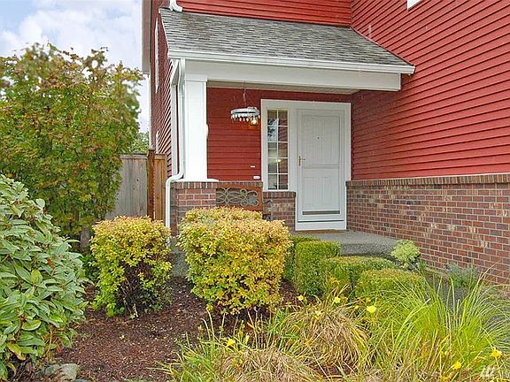 Inviting and Cozy - covered front porch with glass storm door.