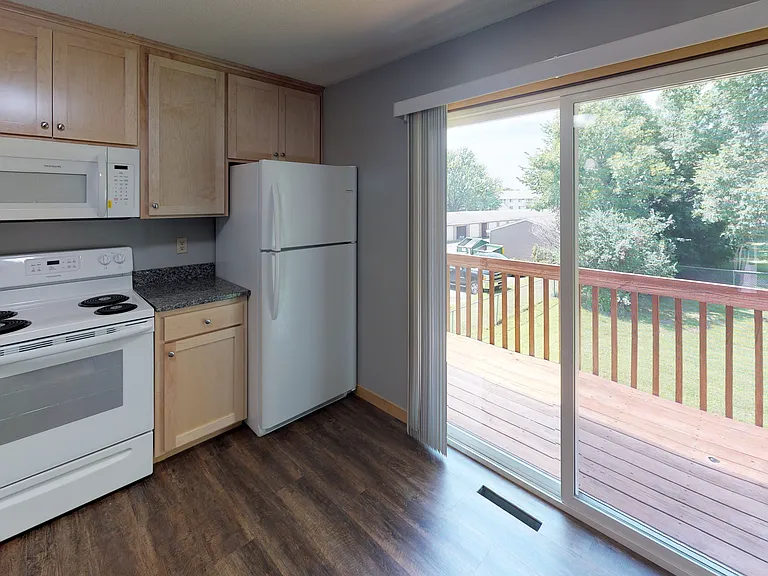 Kitchen featuring access to the patio