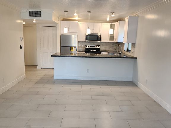 Spacious layout easily fits a full sofa set.