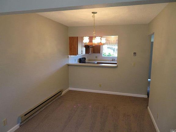 Dining Area looking into kitchen. Bar area for eating too!