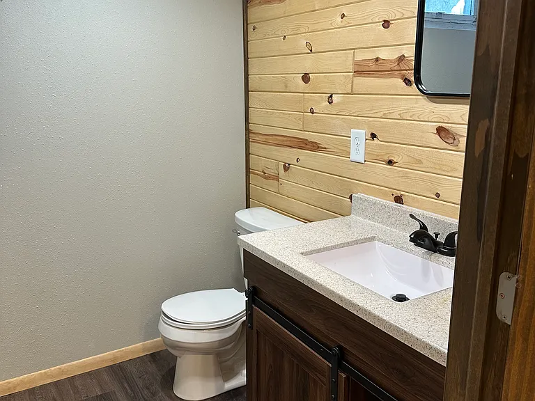 Basement 3/4 bath. The light has a built-in blue tooth speaker!