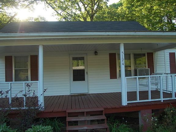 Front view of home with swing