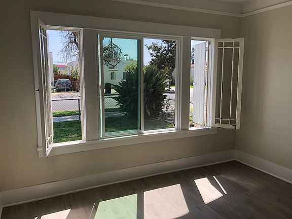 South bedroom with new dual pane windows, vinyl plank flooring