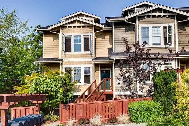 Newer corner unit townhome with maintenance free front yard. Front entry door is on the 2nd floor through the wooden stairway in the front yard. Attached 2 car garage is located on the back of the house with another entry door to the house