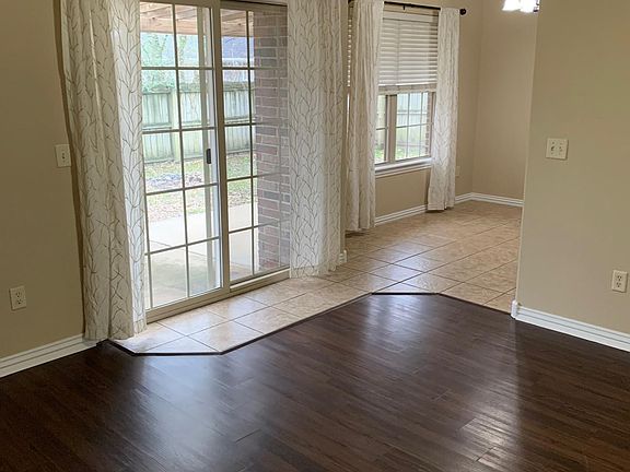 Living room flows into spacious dining area