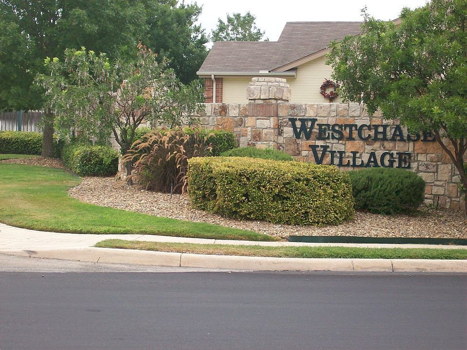 Home is located in small, gated community of Westchase Village