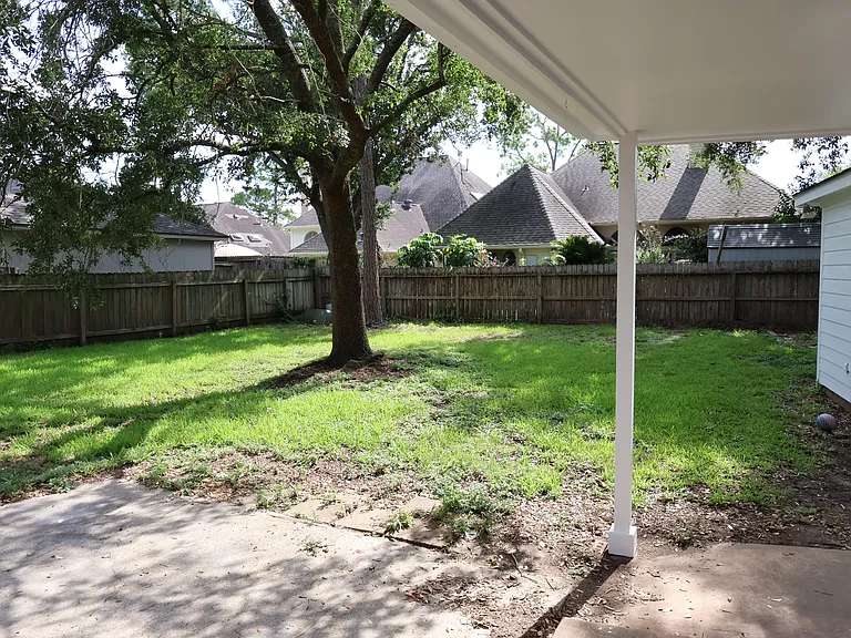 Huge back yard. There is a storage shed behind the garage.