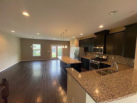 gorgeous hardwood floors, open concept living/ dining/ kitchen area