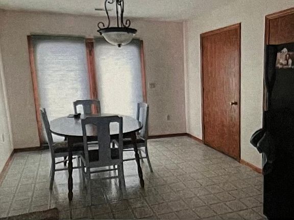 Dining room with patio doors to go to the backyard.