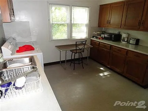 Kitchen of lower level unit.  Laundry in this unit.